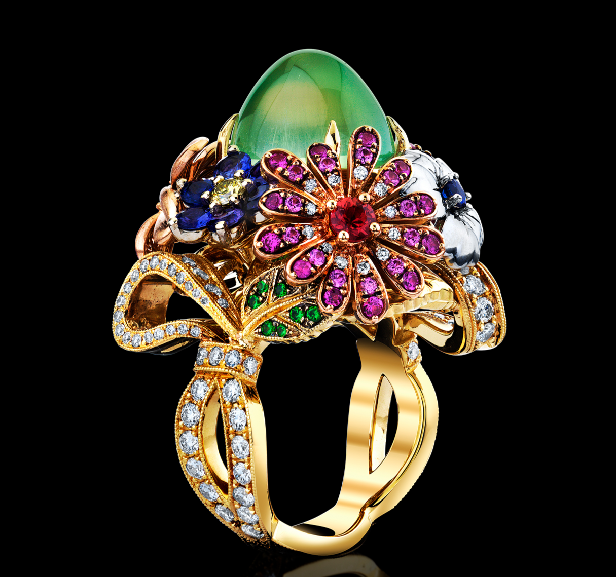 Elaborate gold ring with gemstones on a black background